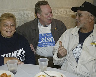William D Lewis The Vindicator Tom Letson, chats with supporters Elanie and Grady Price of Warren during election night party at Enzo's in Warren Tuesday night.