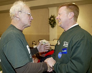 William D Lewis The Vindicator Sean OBien, right talks with supporter Mke Sullivan of Lordstown during a Trumbull Dem party at Enzo'a in Warren Tuesday.
