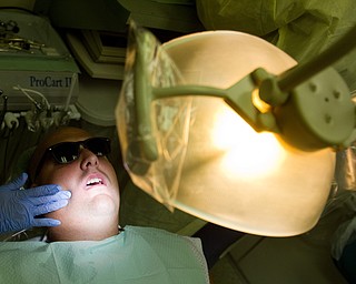 Geoffrey Hauschild|The Vindicator.6.7.2010."I had my jaw broken with a steel pipe," said Kempton Swartwood when asked about his dental history in the Mobile Dental Van, a traveling dentistry service funded by Humility of Mary Health Partners. It visits OVTC multiple times a month.