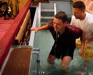 Geoffrey Hauschild|The Vindicator.6.25.2010.Jesse Repko (left) is water baptised by Pastor Bob Pavlich (right) during his graduation ceremony from OVTC at Youngstown Christian Assembly.