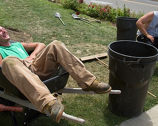 Geoffrey Hauschild|The Vindicator.7.1.2010.Austin Henderson and Kevin Mccoy enjoy a moment of laughter while on break from working at Arlington Heights.