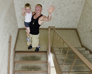 Geoffrey Hauschild|The Vindicator.7.24.2010.OVTC resident Anthony Sanders introduces his son, Michael, to the center while on a Saturday pass.