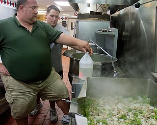 Geoffrey Hauschild|The Vindicator.8.5.2010.Executive Chef Al Franco and Bryan Druschel cook chicken and sauted vegetables for an upcoming catering event while at Ohio Valley Teen Challenge.