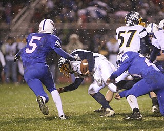 ROBERT K. YOSAY | THE VINDICATOR..Fighting for every yard is McDonald #15 Miles Dunlap as #21 Reserve  Ed Newhouse and #5 John  Rosati  during first quarter action.. McDonald @ Western Reserve - first round .Ó--30-..