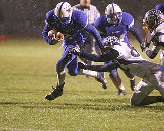 ROBERT K. YOSAY | THE VINDICATOR..Going for pay dirt Reserves #2 Donnie Bolton  breaks out and heads for the goal during second quarter action but is stopped at the two by McDonalds #82 Jared Reckard - Reserve scored on the next play .. McDonald @ Western Reserve - first round .Ó--30-..