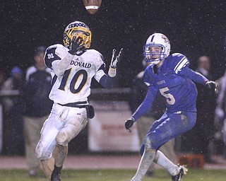 ROBERT K. YOSAY | THE VINDICATOR..Easy Catch as McDonalds #10 Justin Rota pulls in a pass just out of reach of Reserves #5 John Rosati for a first down during second quarter action. McDonald @ Western Reserve - first round .Ó--30-..