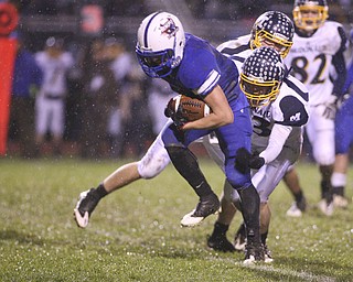 ROBERT K. YOSAY | THE VINDICATOR..Reserves #1 Ryley Sheptock  breaks for a first down as McDonalds #13 Mike Helco tries to bring him down - he does finally. McDonald @ Western Reserve - first round .Ó--30-..
