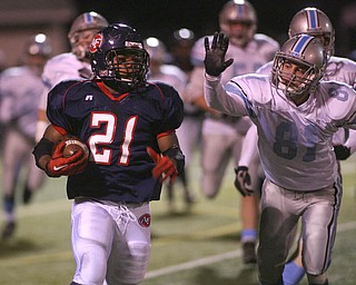 ROBERT  K.  YOSAY  | THE VINDICATOR --..  Fitchs #21  Bruce Reed takes off for  a first down as he escapes from Rebels #81 Tyler Lindgren  as First round of playoffs as Willoughby South Rebel at Austintown Fitch Falcons  second quarter action.. -30-..(AP Photo/The Vindicator, Robert K. Yosay)