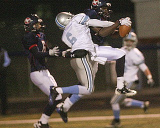 ROBERT  K.  YOSAY  | THE VINDICATOR --..Stopping the drive  as the half ended  Fitchs #13  Will Mahone intercepts  thee Rebels #6  Devyn Woods  as #6 for ftich  Lucas Haupt looks on.. this stopped the drive and a TD and ended the half - First round of playoffs as Willoughby South Rebel at Austintown Fitch Falcons  ... -30-..(AP Photo/The Vindicator, Robert K. Yosay)