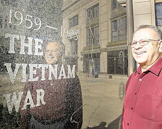 Philip Gonzalez, a Vietnam War Marine veteran, visits the war memorial in downtown Youngstown. Gonzalez received the Purple Heart for an injury suffered during the Battle of Hue.