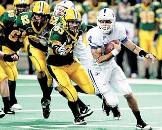 North Dakota State defenders, including Coulter Boyer (92) and Cole Jirik (93) chase after Indiana State quarterback Ronnie Fouch (4) during an NCAA college football game, Saturday, Oct. 23, 2010, in Fargo, N.D.  North Dakota State won 27-15. (AP Photo/The Forum, Dave Wallis)