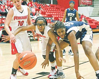 YSU - PITT - (10) Maryum Jenkins and (5) Kenya Middlebrooks fight with (32) Selena Nwude for the ball during their game Wednesday night. - Special to The Vindicator/Nick Mays