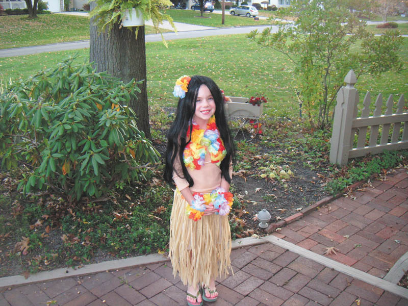 Decked out in Hawaiian gear, Sidney Laughner of Youngstown looks like she's ready for a warm Halloween.