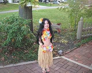 Decked out in Hawaiian gear, Sidney Laughner of Youngstown looks like she's ready for a warm Halloween.