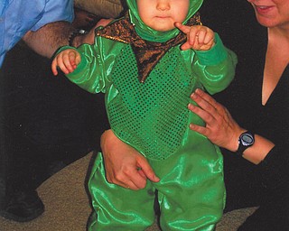 Emily Marie Deming, 11 months, was the Princess Frog this year. She's shown with her parents, Dan and Kim Deming, of Sandusky. Emily, whose costume was made at Cedar Point, has grandparents in Austintown, Youngstown and Canfield.