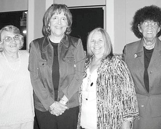 Headed in new direction: As she headed for retirement after serving as executive director for Trumbull County Children Services Board from 1975 to 2010, Marcia Tiger was honored by fellow workers, friends and family members during a party recently at the Hippodrome in Warren. Among the well-wishers who shared the bittersweet moment with Tiger, second from left, are her coworkers from Children Services, from left, Carole Menelle, E. Carol Maxwell and Shelby McElravy.