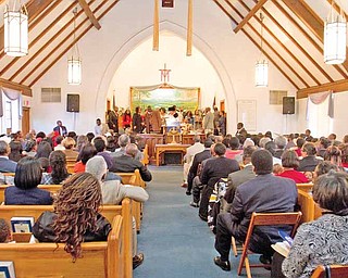 Geoffrey Hauschild|The Vindicator.A service at Holy Trinity Missionary Baptist Church on Sunday afternoon. The church on Youngstown's South Side is celebrating its 60th anniversary. The church on Youngstown's South Side is celebrating its 60th anniversary.