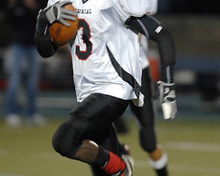 Campbell's Jales Hughes (03) runs the ball against Manchester on Friday night at Ravenna High School Stadium.