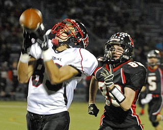 Campbell's Richard Bledsoe attempts to catch a long throw while Manchester's Kyle Dougherty run at his heels on Friday night at Ravenna High School.