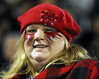 Students paint their faces and wear red to support the Campbell Devil's during the playoffs against Machester High School.