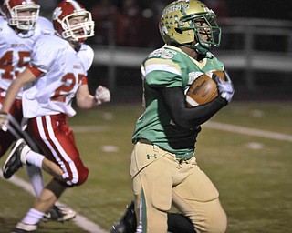 Ursuline's Akise Teague runs for a 1st half TD the against Norwayne during their game at Green on Saturday night. Photo/Mark Stahl