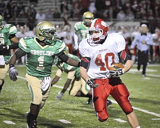Ursulin'e Trevor Smith chaces down Norwayne's Tyler Zimmerly, 40, during their game at Green on Saturday. Photo/Mark Stahl