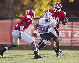Geoffrey Hauschild|The Vindicator.Indiana State's Bryant Kent (1) makes his way downfield though ultimately being brought down by YSU's Brandian Ross (1) and Obinna Ekweremuba (90) during the fourth quarter of a game at YSU's Stambaugh Stadium on Saturday afternoon.