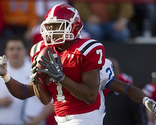 Geoffrey Hauschild|The Vindicator.YSU's Ely Ducatel (7) snags a ball thrown by wide receiver Dominique Barnes and is eventually brought down by Indiana State's Jonny Towalid (28) during the fourth quarter of a game at YSU's Stambaugh Stadium on Saturday afternoon.