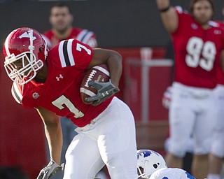 Geoffrey Hauschild|The Vindicator.YSU's Ely Ducatel (7) snags a ball thrown by wide receiver Dominique Barnes and is eventually brought down by Indiana State's Jonny Towalid (28) during the fourth quarter of a game at YSU's Stambaugh Stadium on Saturday afternoon.