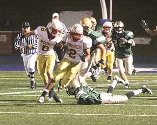 PLAYOFF - Charlie Brown looks for running room during their game Saturday night. - Special to The Vindicator/Nick Mays