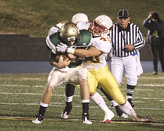 PLAYOFF - (40) Nick Hargate of Mooney stops (12) Kevin Besser during their game Saturday night. - Special to The Vindicator/Nick Mays