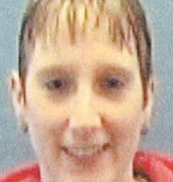 This undated family photo provided by WBNS-10TV on Friday, Nov. 12, 2010, shows 32-year-old Tina Herrmann. Authorities were searching for Herrmann, her two children and a female friend in an investigation that prompted an overnight lockdown on the campus of Kenyon College, where the woman's pickup truck was found nearby, a sheriff said Friday. The children's father said blood was discovered in the mother's home. (AP Photo/WBNS-10TV)