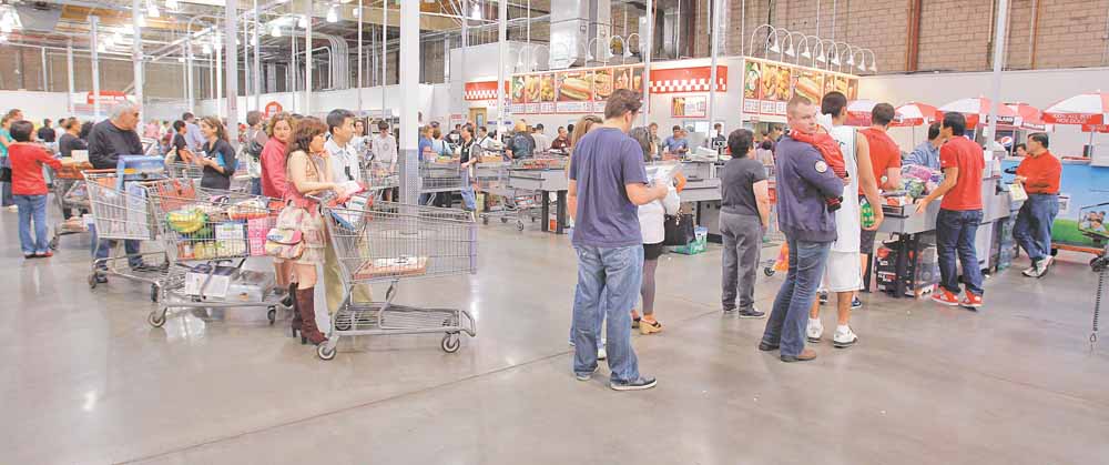 In this Nov. 6, 2010 photo, shoppers wait in line at Costco in Mountain View, Calif. The Labor Department said Tuesday, Nov. 16, that the Producer Price Index rose 0.4 percent last month, the same increase as September and August. (AP Photo/Paul Sakuma)