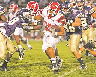 YSU tailback Jamaine Cook tries to avoid the pursuit of WIU linebacker Anthony D'Astice during the first half of the Penguins' game at Western Illinois. Cook had 72 yards on 17 carries in the first half.