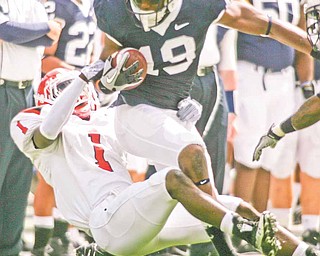 YSU  #1  Brandian Ross brings down PSU  #19  Justin Brown during first quarter action as YSU loses 44-14   to Penn State at Beaver Stadium in Happy Valley.