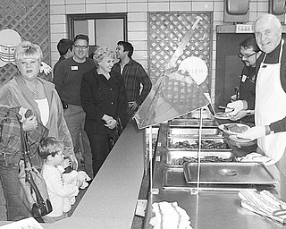 Youngstown Rotary Club sponsored its annual pancake breakfast Nov. 7 at the Ursuline High School cafeteria. This was one of the many fundraisers to help the Rotary Foundation with various projects for the coming year. The Ursuline High School Interact Club, which is a Rotary-sponsored service club, assisted the regular members in serving the all-you-can-eat pancake-and-sausage breakfast. From left are Tairy Colaluca with her grandson, Jermey Colaluca, Rotarian Jeff Byce and Theresa Starr. Rotarians serving are John Slanina and Dr. Bill Cleary.