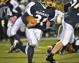 McDonals Zach Tura runds the ball against Mogadore during their Div VI playoff game at Twinsburg on Friday night. Photo/Mark Stahl