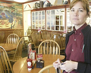 William D Lewis the Vindicator  Friendly's in Poland was closed because of a boil water alert Friday. Restuarant supervisor Kathy fox stands in an empty dining room Friday.