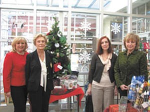 Looking forward to greeting guests at the 40th Annual American Holiday Fine Arts and Crafts Show and Sale at The Butler Institute of American Art are, from left, committee members Helen Paes and Julia Hoover; Renée Sheakoski, museum gift show manager; and Pat Almasy, gift shop volunteer.
