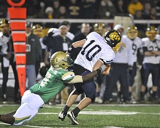 Ursuline's Keil'n Thurston takes down Kirtland QB Ryan Loncar during the 1st half of their game in Auora on Saturday night. Photo/Mark Stahl