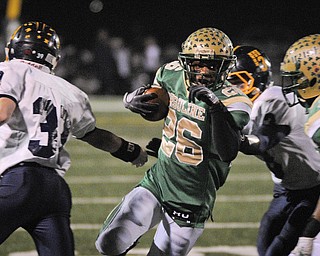 Ursuline's Akise Teague runs the ball against Kirtland during the 2nd half of their game in Auora on Saturday night. Photo/Mark Stahl