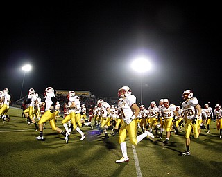 NOVEMBER 20 - RAVENNA-OHIO: The Cardinal Mooney Cardinals run onto the field befor the start of play against the Akron Buchtel Griffs at Ravenna High School on November 20, 2010. (photo by: Justin K. Aller)