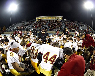 NOVEMBER 20 - RAVENNA-OHIO: The Cardinal Mooney Cardinals pray before taking on the Akron Buchtel Griffs at Ravenna High School on November 20, 2010. (photo by: Justin K. Aller)