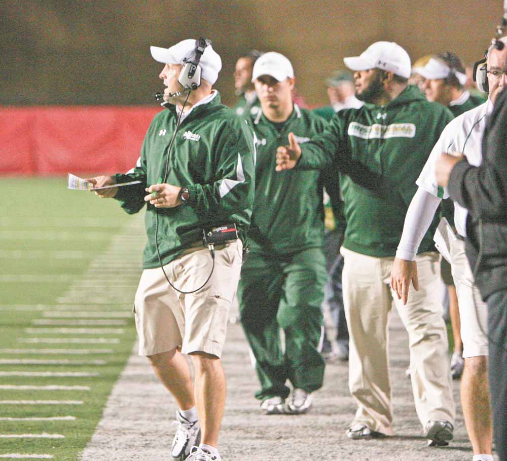 While Ursuline coach Dan Reardon, left, spends Saturday nights in the spotlight, he and his staff spend the bulk of their efforts on the days leading up to each playoff game.