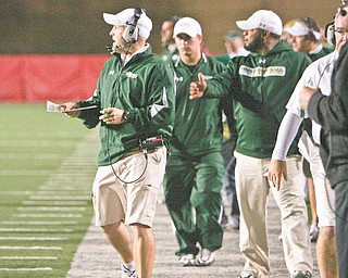 While Ursuline coach Dan Reardon, left, spends Saturday nights in the spotlight, he and his staff spend the bulk of their efforts on the days leading up to each playoff game.