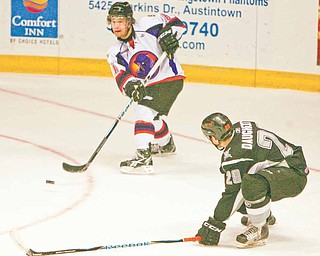 Phantoms forward Ryan Belonger moves the puck around defender Omaha Lancers defender Ryan Daugherty during last Friday’s game. Wednesday, the Phantoms will be at home against the Indiana Ice.