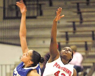YSU's Brandi Brown and IPFW's Stephanie Rosado go for the ball during Saturday action at YSU.