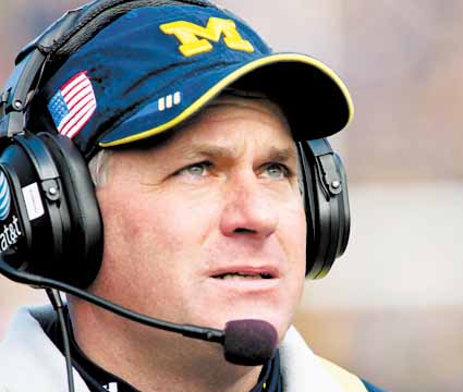 Michigan head coach Rich Rodriguez looks on from the sideline in the first quarter of an NCAA college football game with Illinois, Saturday, Nov. 6, 2010, in Ann Arbor, Mich. 