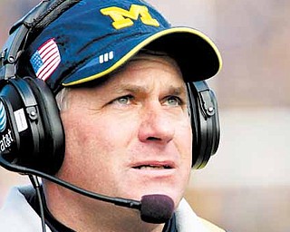 Michigan head coach Rich Rodriguez looks on from the sideline in the first quarter of an NCAA college football game with Illinois, Saturday, Nov. 6, 2010, in Ann Arbor, Mich. 