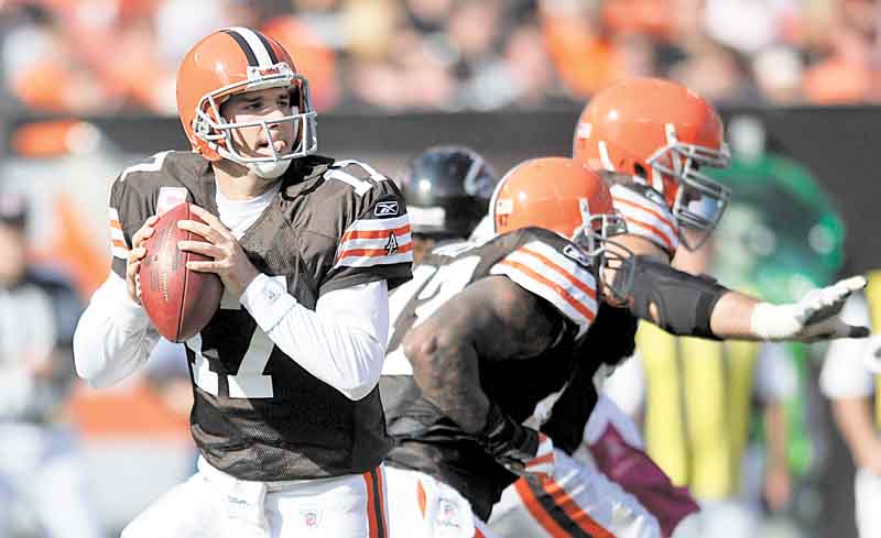 This Oct. 10, 2010, file photo shows Cleveland Browns quarterback Jake Delhomme (17) going back to pass against the Atlanta Falcons during an NFL football game in Cleveland.  With Colt McCoy out with a high left ankle sprain, Delhomme, who has been inactive for eight games because of a similar injury, will start Sunday against his former team, the Carolina Panthers.